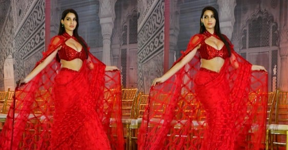 Nora Fatehi Stylish Arrival in Fiery Red Saree at Jio World Plaza Launch